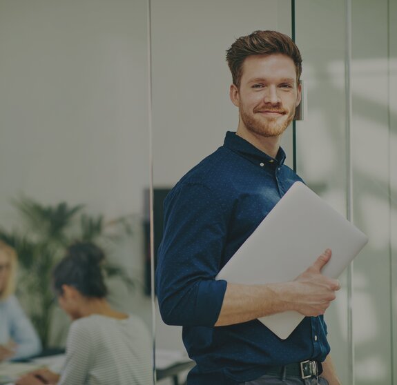 man with notebook in meeting room it jobs timetoact group